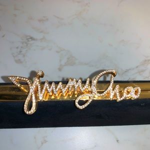 Jimmy Choo black suede, gold tone metal and crystal Celeste Logo Clasp Clutch